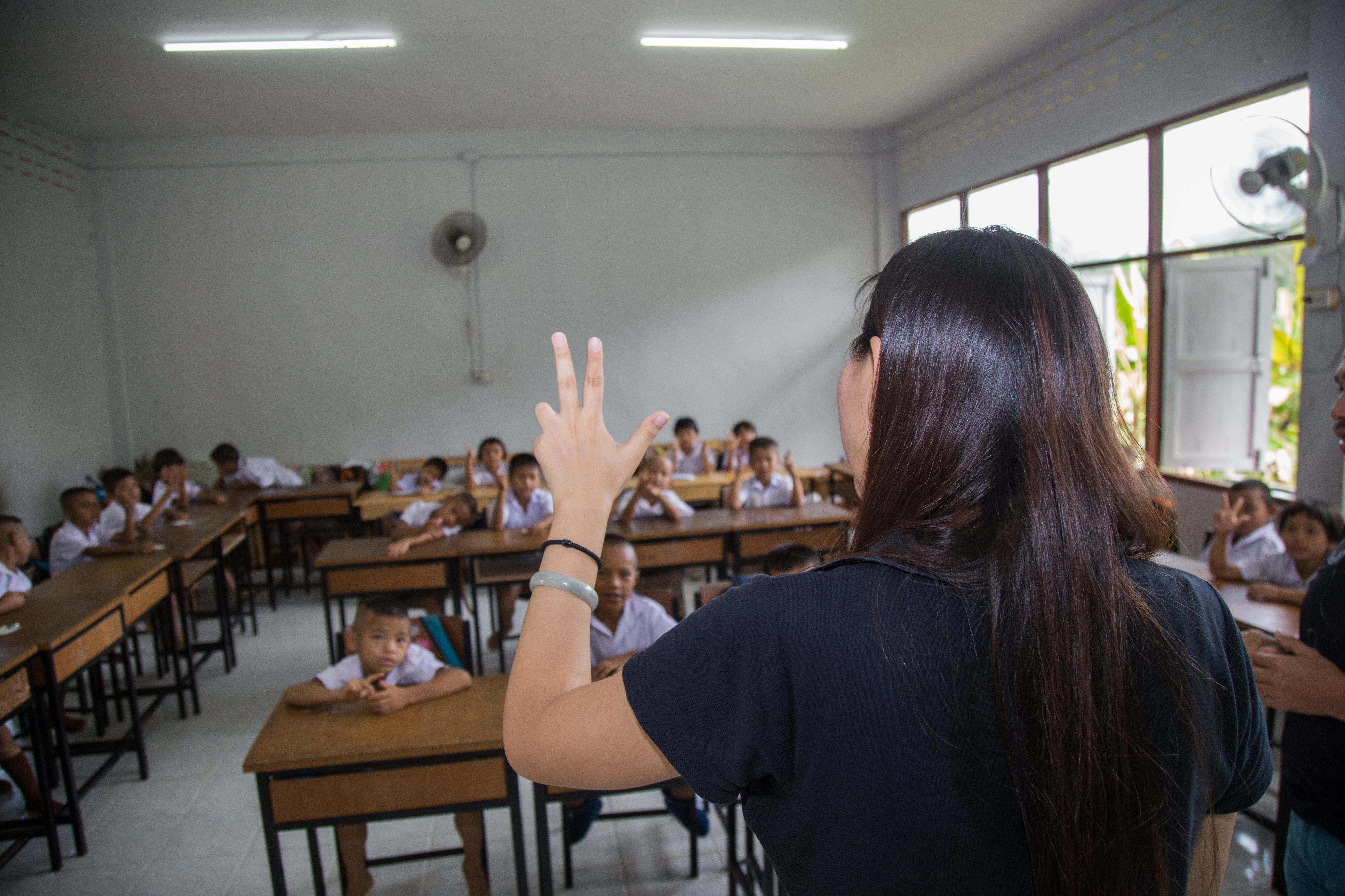 _ A Teacher and Students practicing numbers
