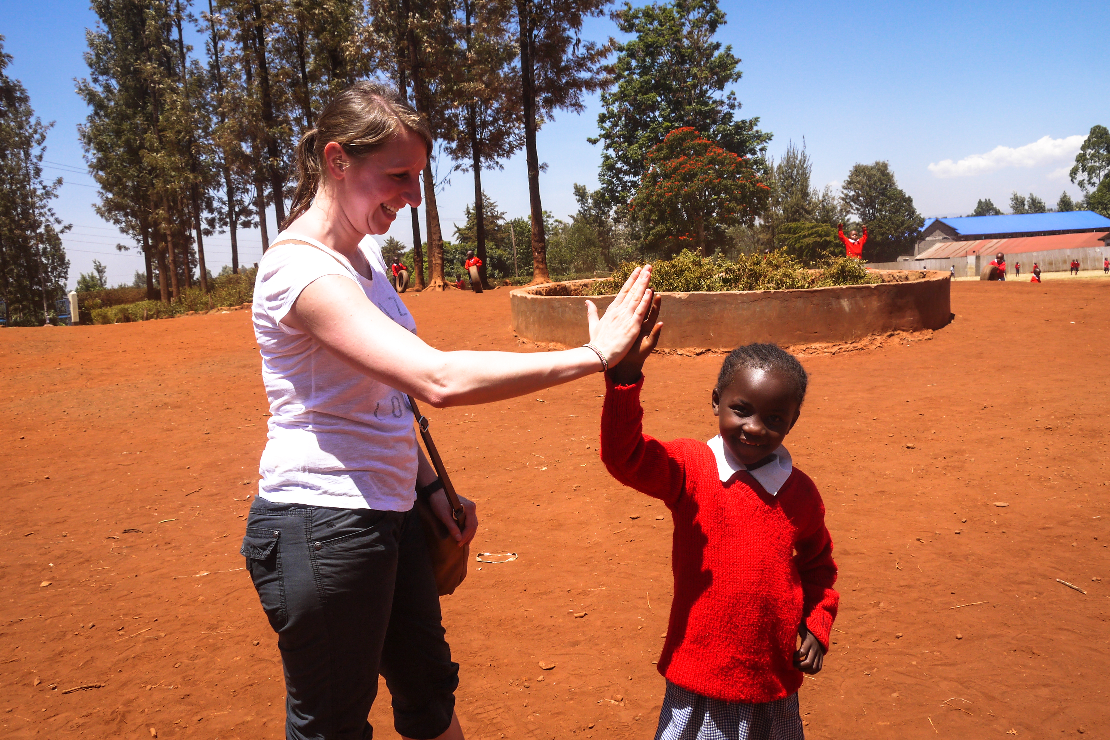_Participant high fiving a student