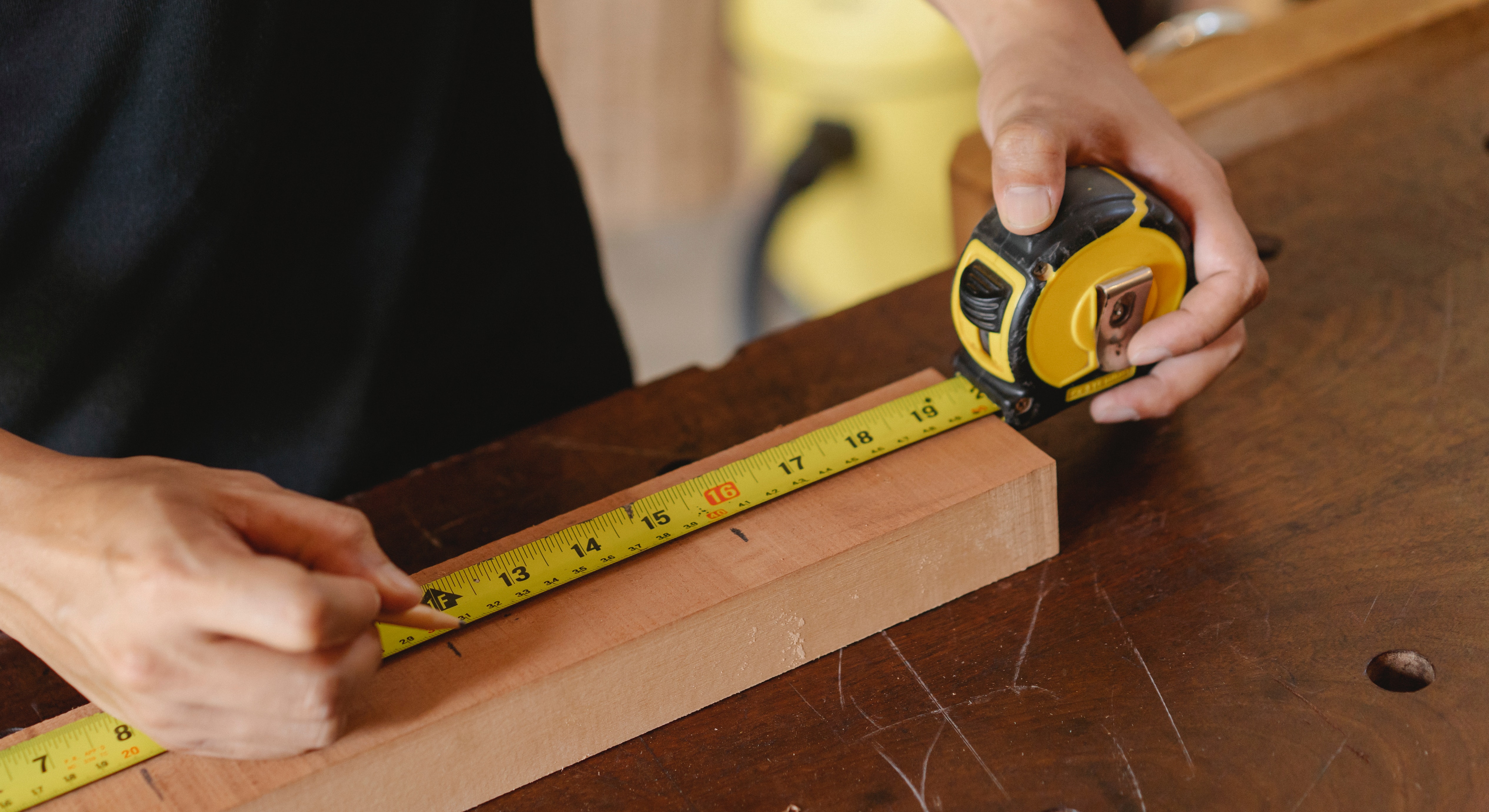 Participant measuring wood fittings
