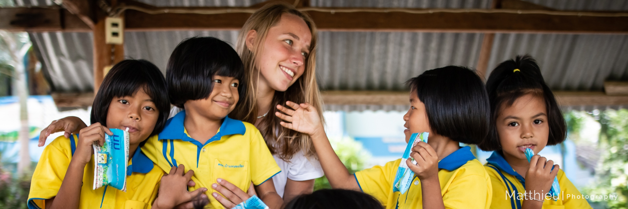 Participant with students during break time