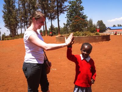 _Participant high fiving a student